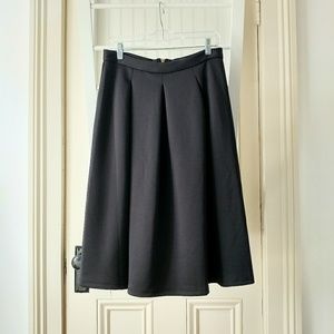 Pleated neoprene midi skirt